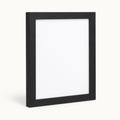 Modern matte black 8 by 10 wall picture frame on a light background