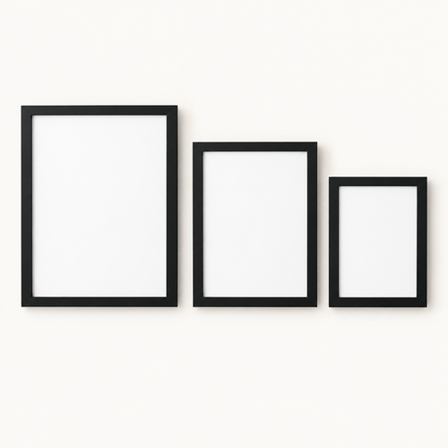 Set of three minimalist black gallery wall picture frames on a light background