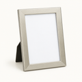 Champagne-silver 5 by 7 picture frame on a light background